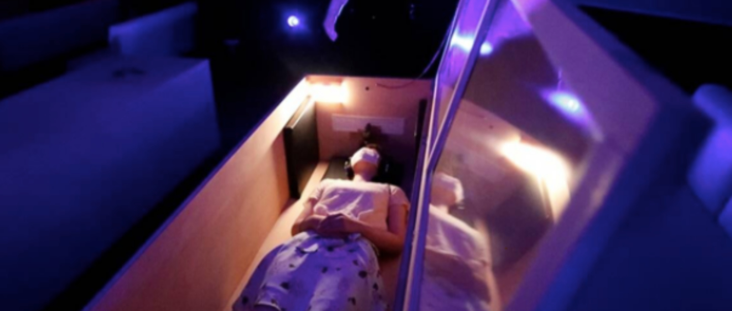 Want To Take Your Mind Off COVID? NP, Just Lay In A Glass Coffin Surrounded By Zombies