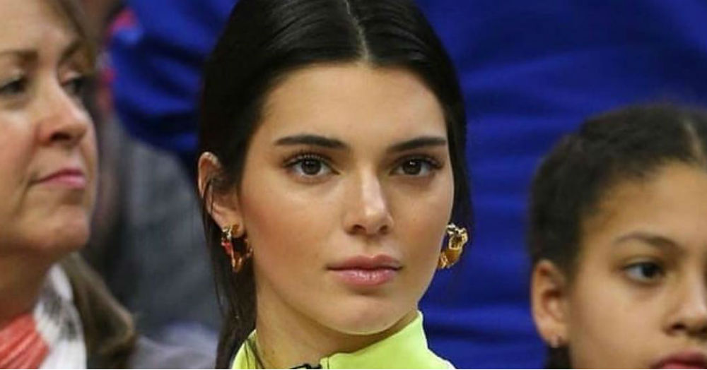 Kendall Jenner makes the case for statement gold hoops during LFW