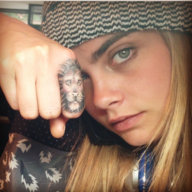 Classy women’s finger tattoo - Lion Tattoo