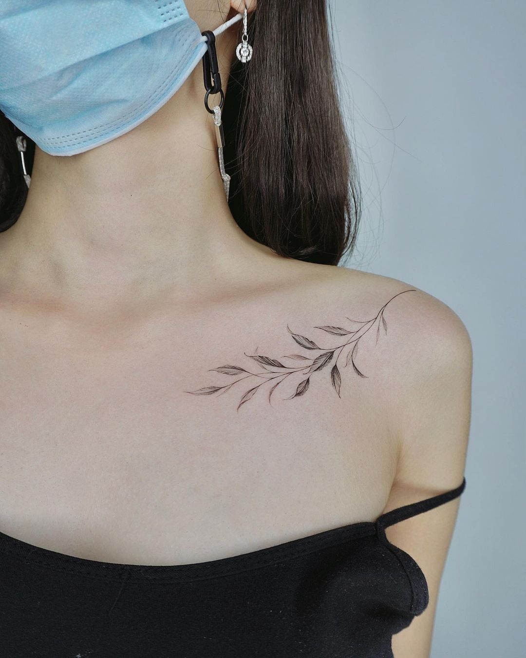 String of hearts realistic bohemian plant tattoo dangling on woman's  shoulder. tattoo idea | TattoosAI