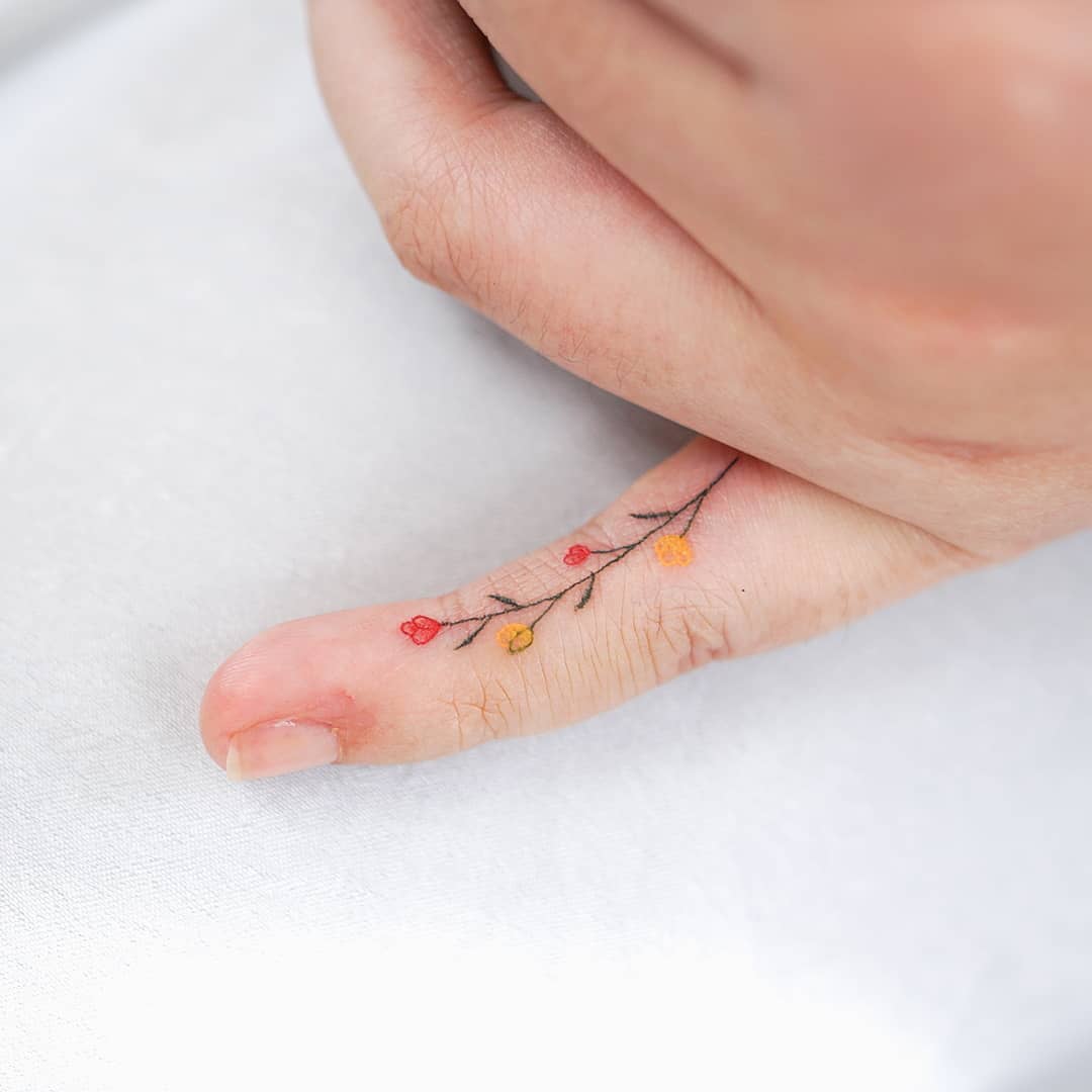 Floral Side Finger Tattoo