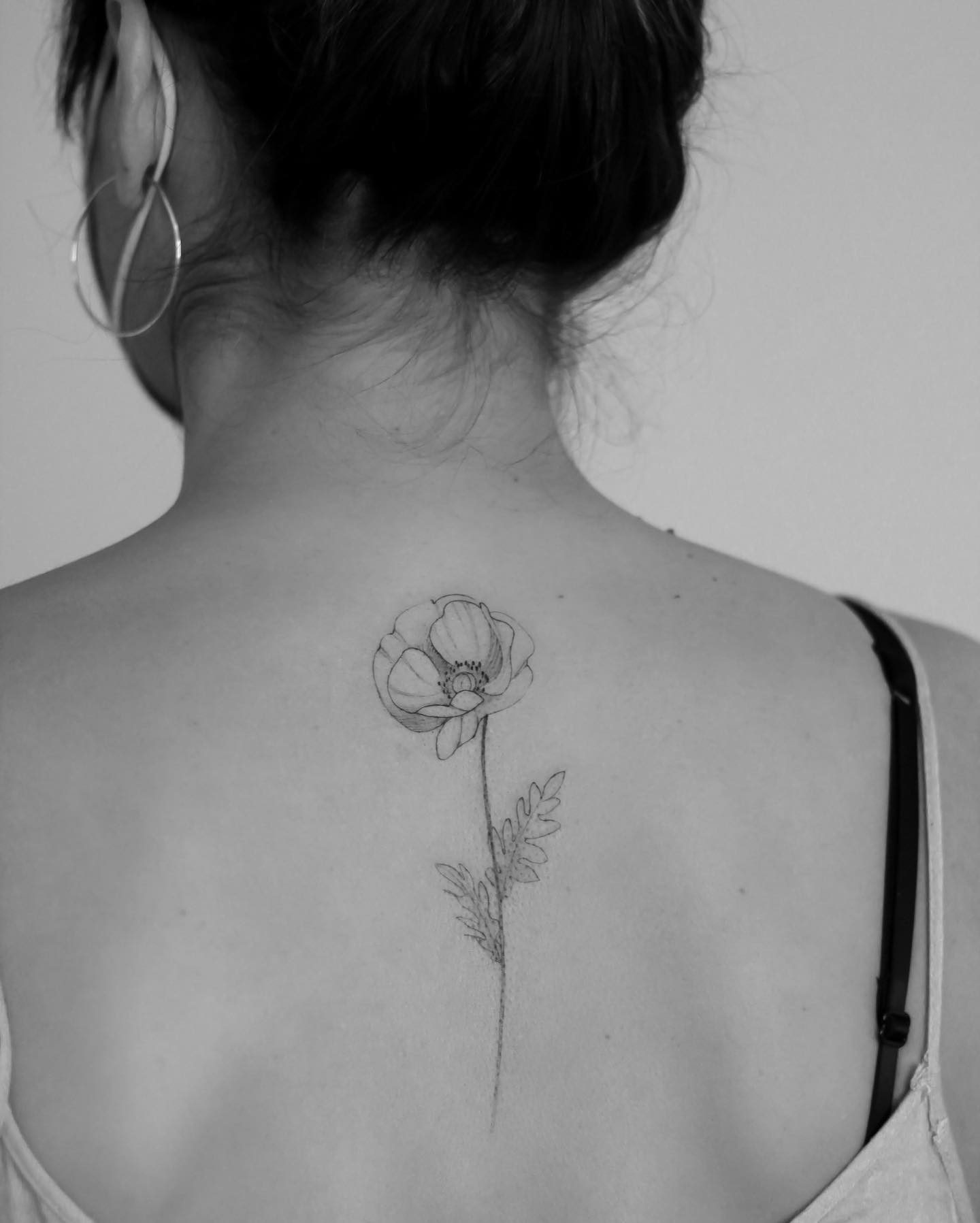 Flowers tattoo on the upper back  Tattoogridnet