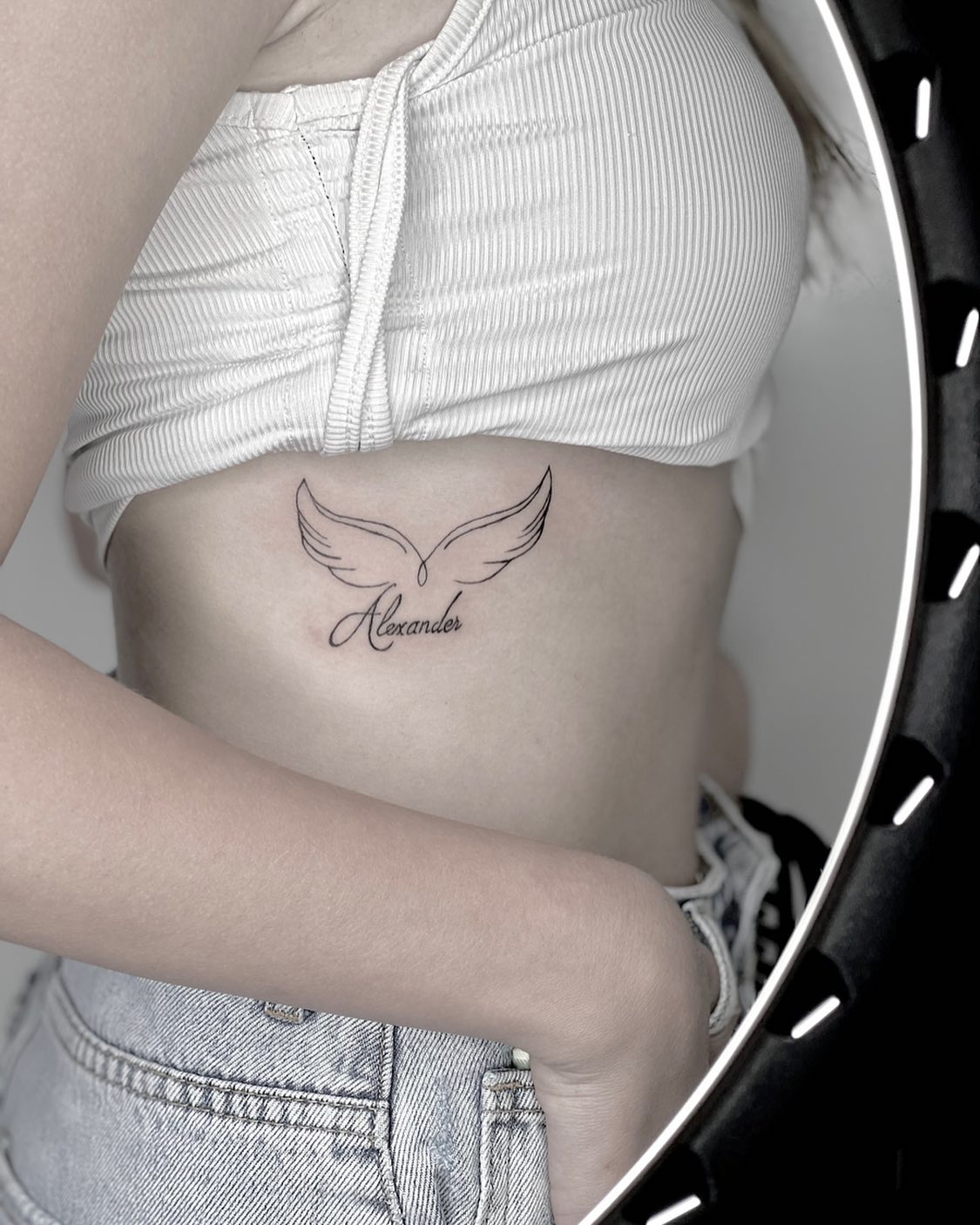 angel wings tattoo on ribs