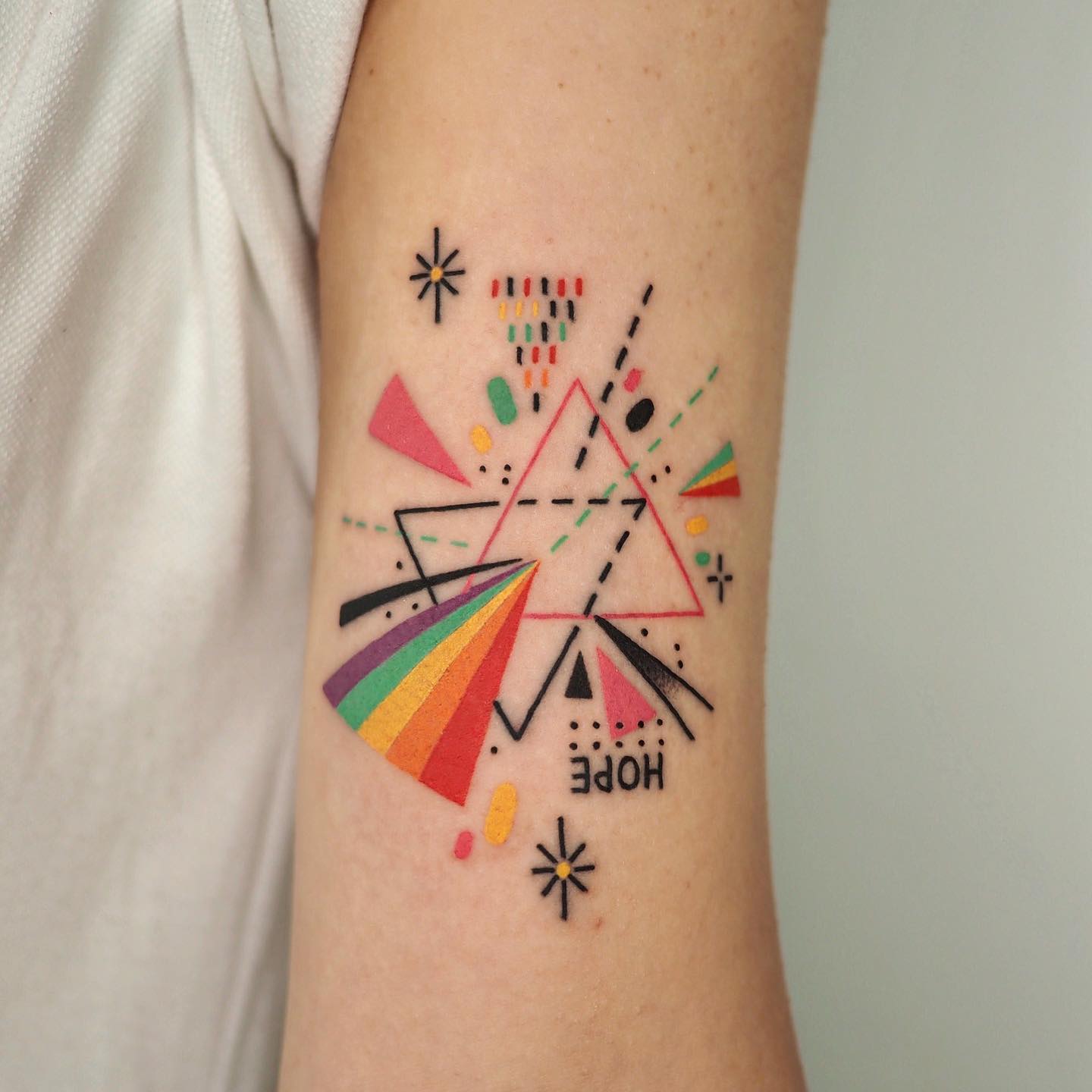 Penrose triangle tattoo on the sternum - Tattoogrid.net