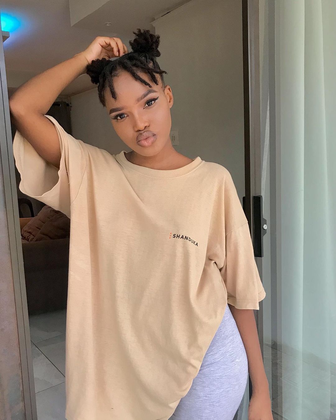 Fringes And Space Buns Dreadlock Hairstyles