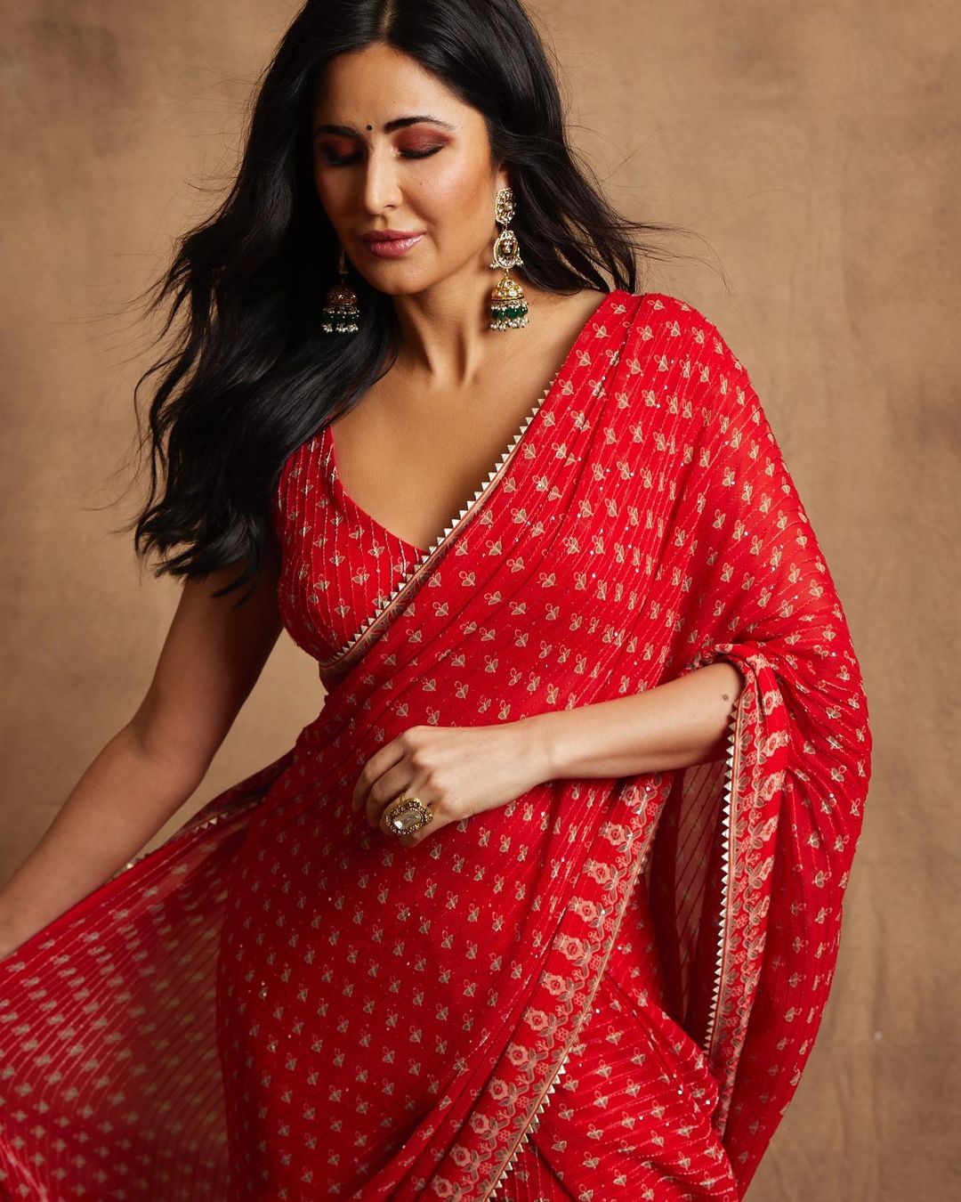 A beautiful woman in red sari