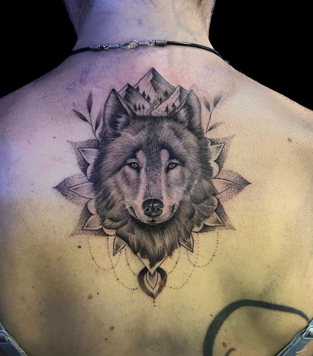Leg sleeve with mandela patterns and a wolf tattoo idea | TattoosAI