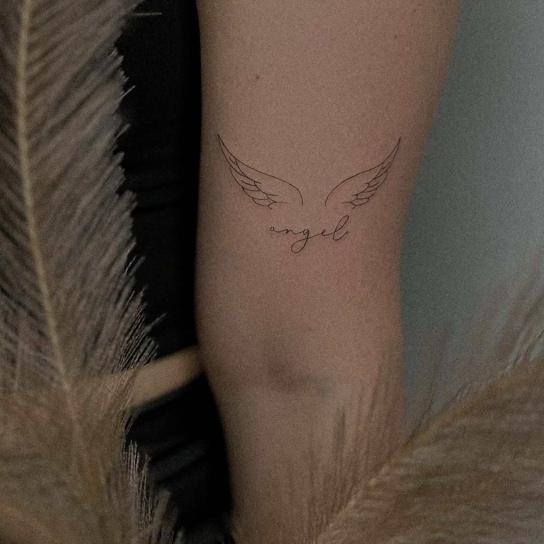 angel wing tattoo arm