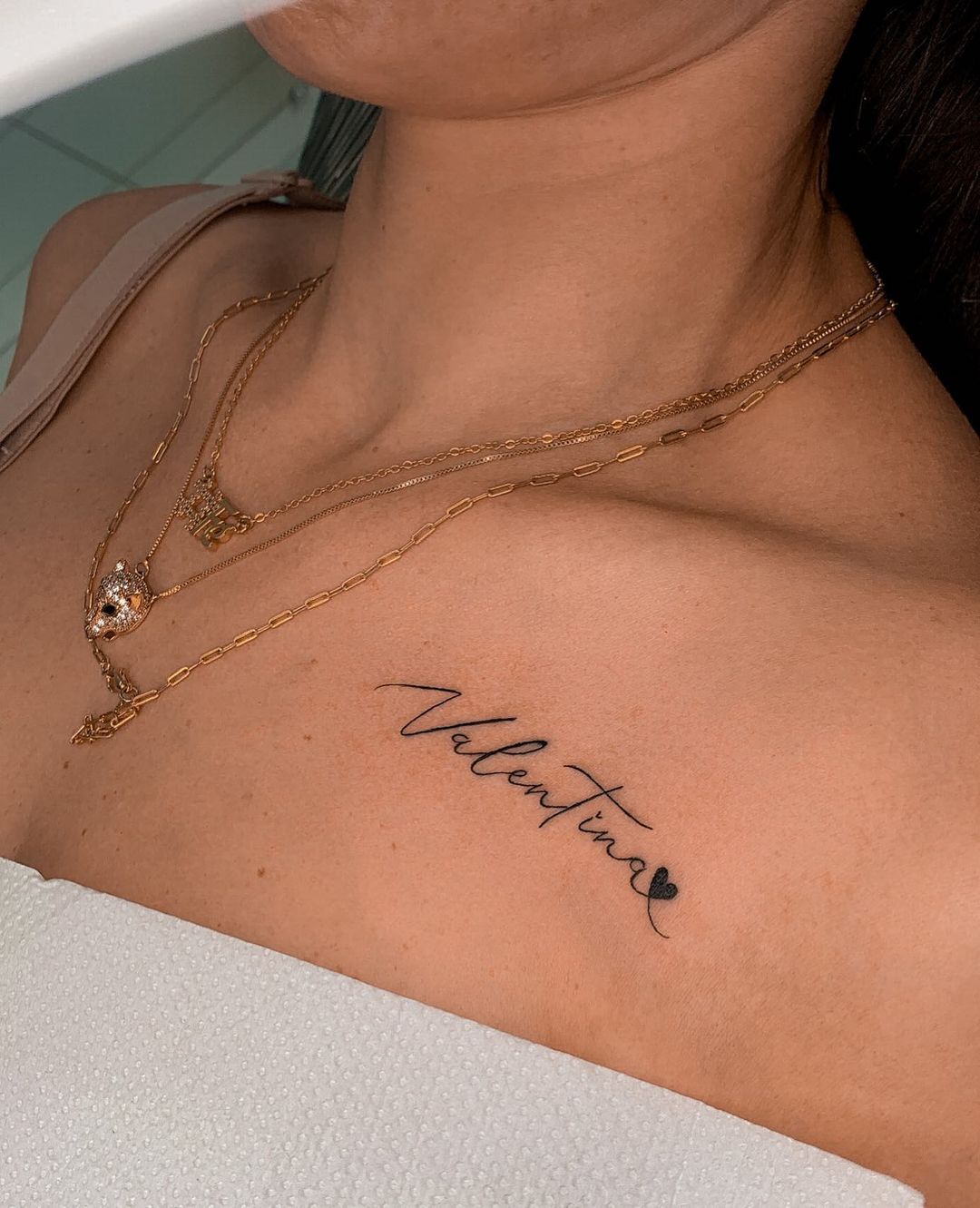 rose tattoos on chest with names